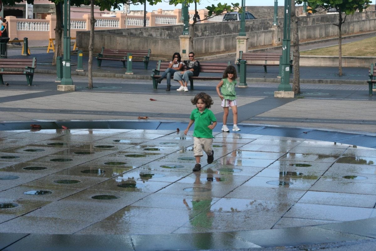 Lucas testing the water in the fountain in Old San Juan
