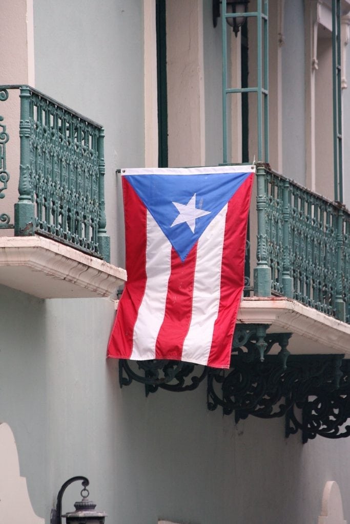 Puerto Rican Flag Hanging off of a Balcony in Old San Juan.
Puerto Rico Travel