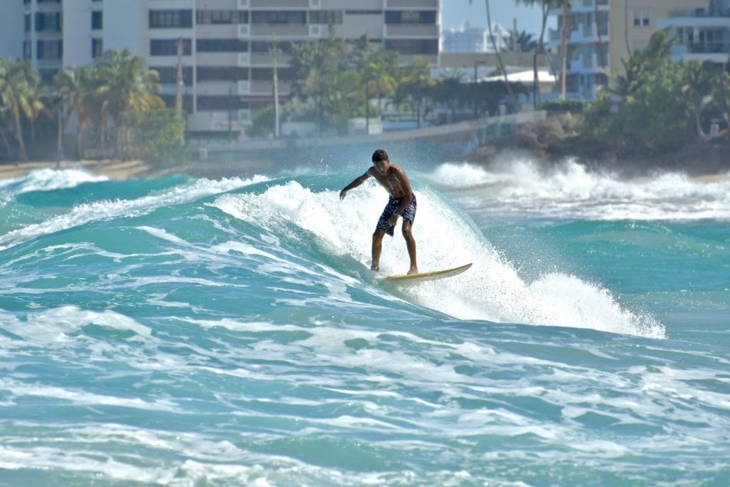 Things to Do In Puerto Rico.  
Surfer in Condado Beach